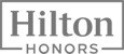 This image shows the Hilton Honors logo, featuring the words "Hilton Honors" in a bold, modern font framed by a rectangular outline.