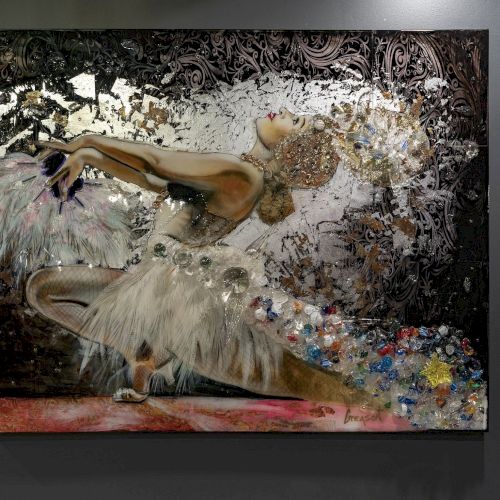 The image shows a decorative artwork of a dancer in a dynamic pose with a feathered costume, set against an ornate background.