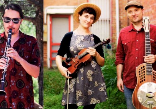 Three musicians outdoors: a clarinetist on the left, a violin/mandolin duo in the middle, and a guitarist with a resonator on the right.